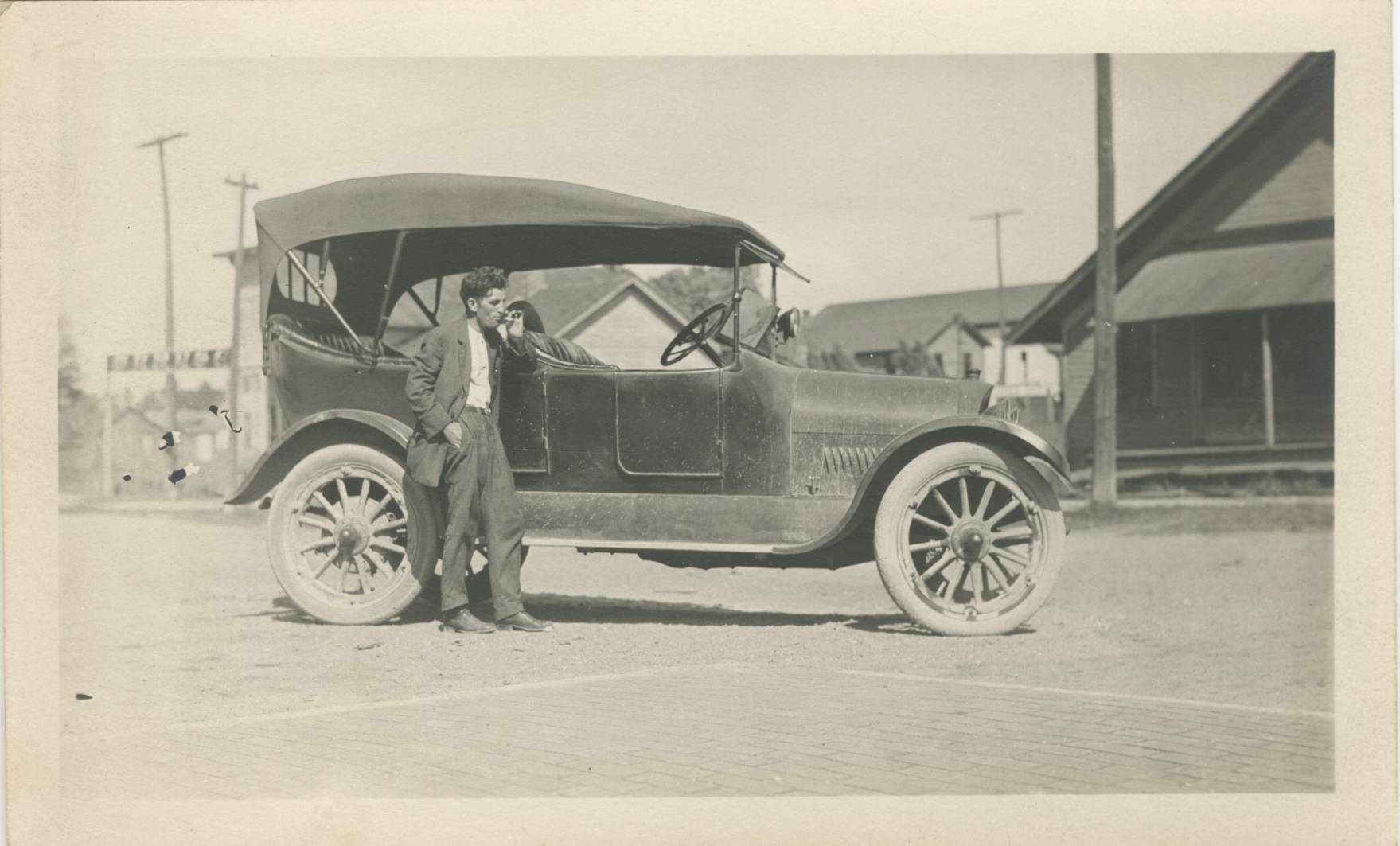 untitled photo of man with car
